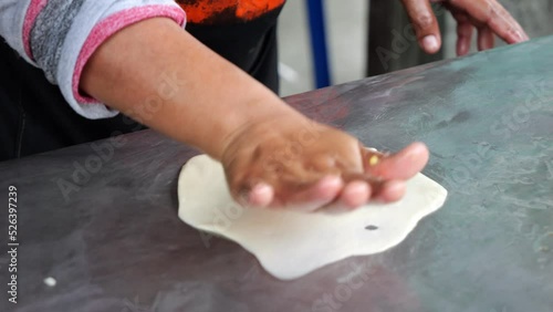 4K-Slow motion video. The seller is making roti. which is a famous street food of Thailand