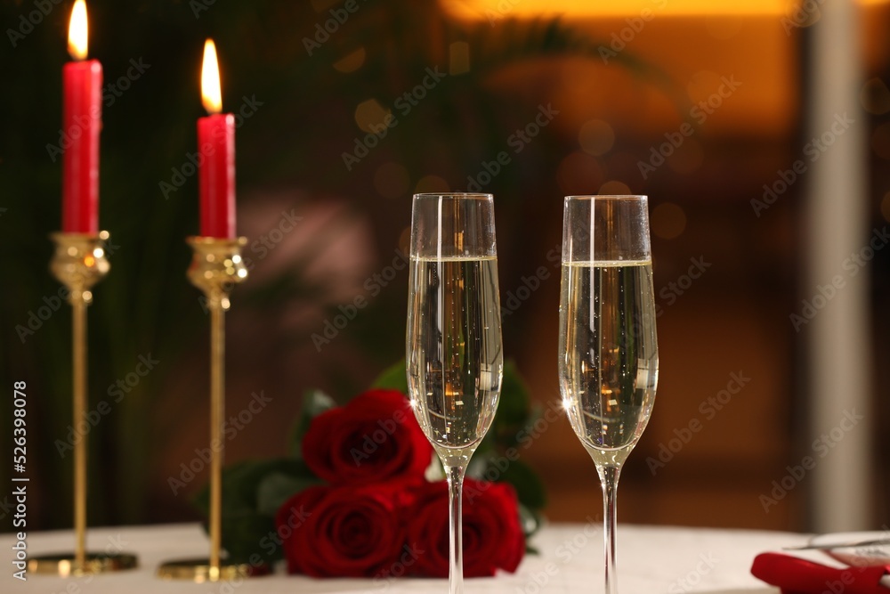 Glasses of champagne on table in restaurant. Romantic dinner