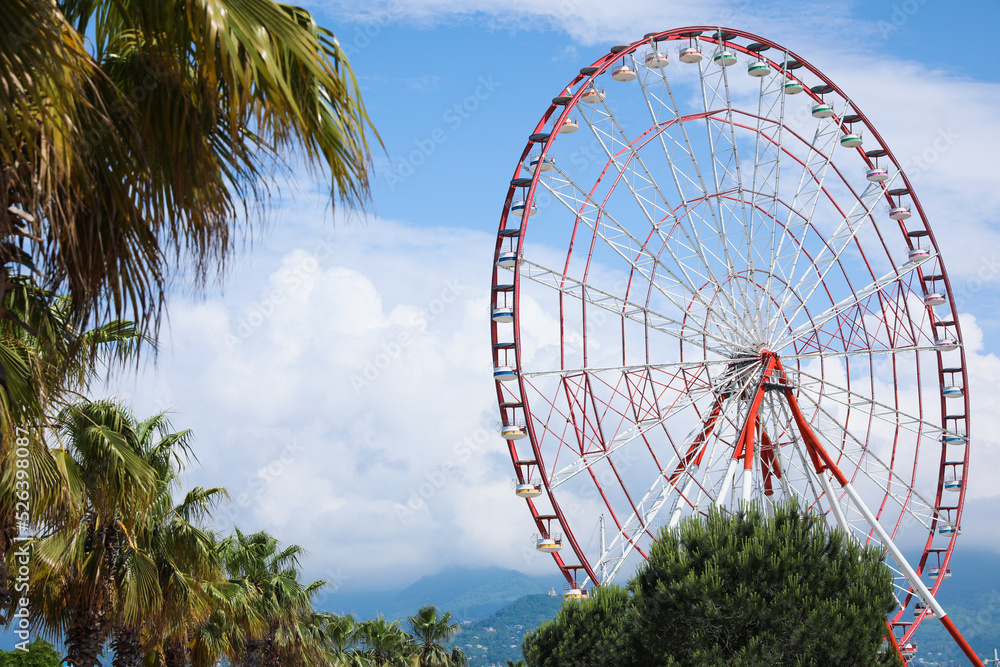 Fototapeta premium Beautiful large Ferris wheel outdoors on sunny day