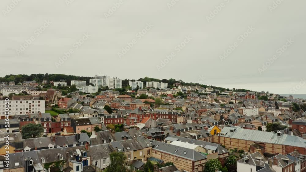 Horizontal panning from a drone, a view of an old European city located on a hill near the sea. Traditional houses and modern buildings, bird's eye view. France Horizontal panning from a drone, a view of an old European city located on a hill near the sea. Traditional houses and modern buildings, bird's eye view. France