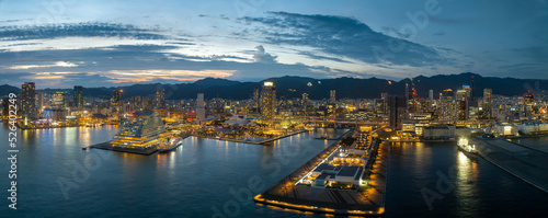 Panoramic aerial view of Kobe City waterfront and skyline at sunset