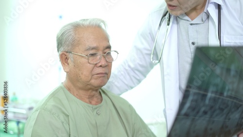 Asian elder adult having a consult with doctor about his disease.