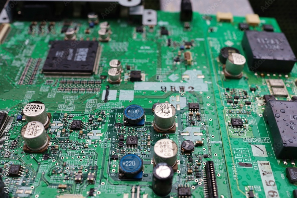 A semiconductor on a printed circuit board wet from the rain.Image: recession, bankruptcy. A semiconductor on a printed circuit board wet from the rain.Image: recession, bankruptcy.