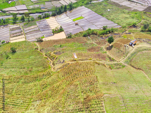 Abstract Defocused Blurred Background Aerial photography scenery of terraced rice fields in a valley in the Cicalengka area - Indonesia, Not Focus photo