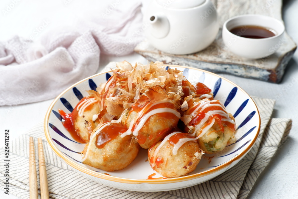 Takoyaki is one of the popular Japanese snacks-( たこ焼き), in the form of small balls filled with pieces of octopus inside Takoyaki is one of the popular Japanese snacks-( たこ焼き), in the form of small balls filled with pieces of octopus inside
