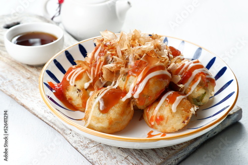 Takoyaki is one of the popular Japanese snacks-( たこ焼き), in the form of small balls filled with pieces of octopus inside