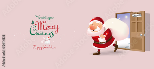 Santa Claus pulls a heavy white bag full of gifts come inside door with Merry Christmas message