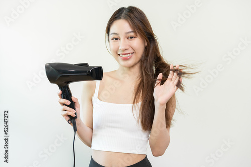 Hair Dryer, beautiful happy, asian young woman, girl hand in using, holding hairdryer to dry, blowing blonde long straight after shower at home. Hairdressing, hair treatment isolated on background.