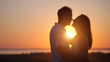 Husband expresses true love to gorgeous wife at back sunset. Couple silhouettes look at each other with lovely smile and enjoy landscape together closeup