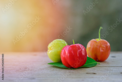 Fotografi fresh cherry with leaves , on wood background, Red fresh cherry