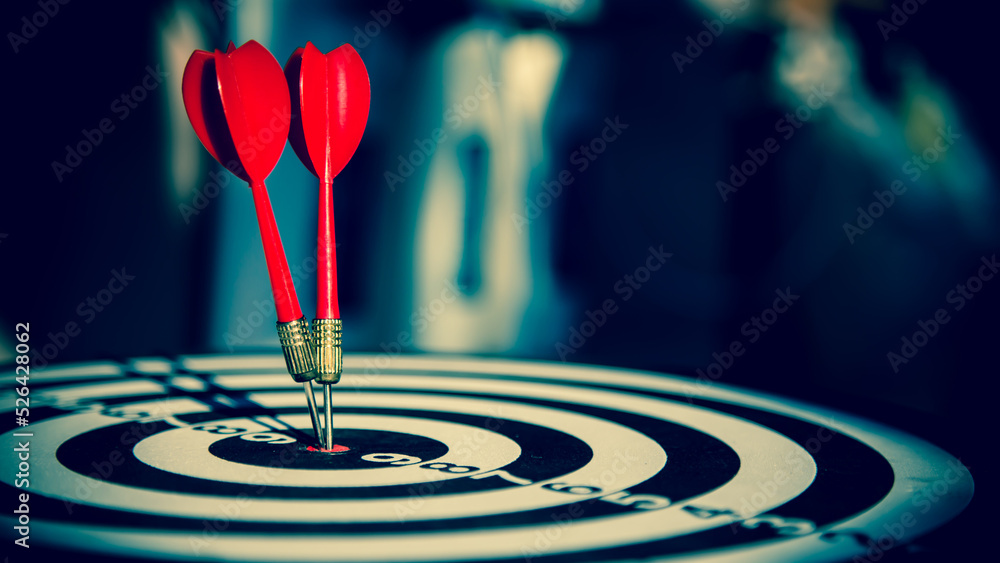 Bullseye target goal or dartboard has dart arrow throw hitting center shooting for financial business targeting planning to winner concept. Bullseye target goal or dartboard has dart arrow throw hitting center shooting for financial business targeting planning to winner concept.