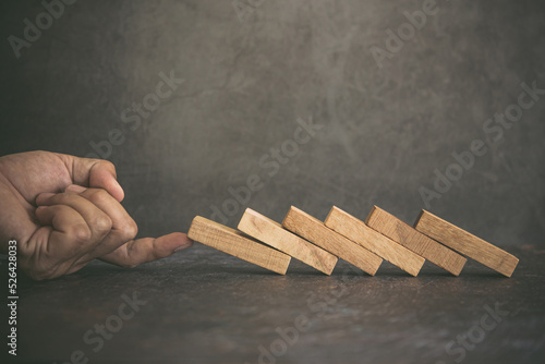 Photography Hand prevent wooden block tower stack not crash or fall