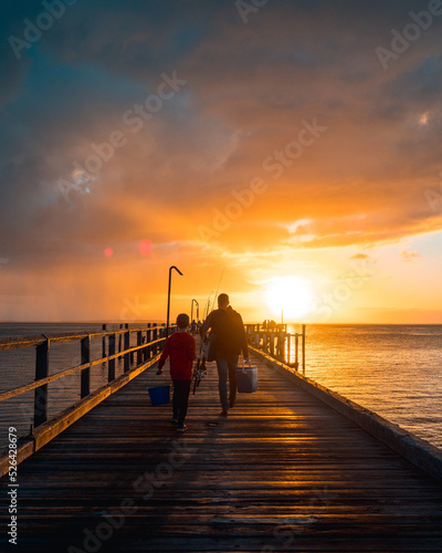 Fototapeta Naklejka Na Ścianę i Meble -  Parent and child on Pier
