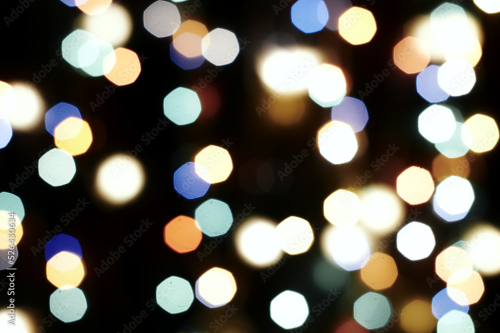 Fototapeta premium multicolored festive lights on a black background screensaver backdrop