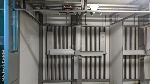 The interior of the broiler hatchery has cooling fan blades and other components.