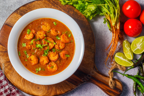 Indian food prawn curry masala with coriander leaves. 
