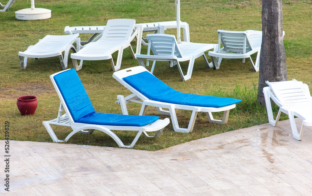 Sunbeds and deck chairs by the pool.