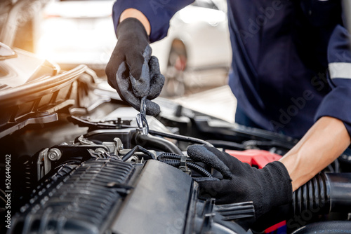 Car care maintenance and servicing, Close-up hand technician auto mechanic using the wrench to repairing change spare part car engine problem and insurance service support.