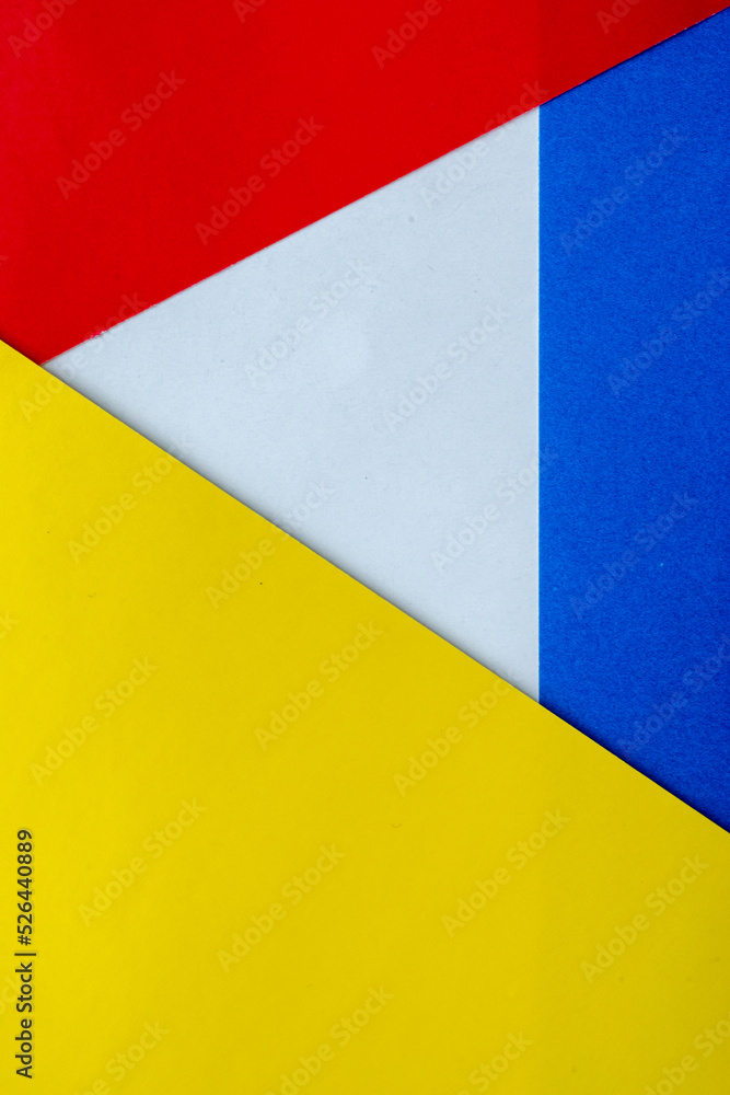 Abstract paper is a colorful background, a creative design for pastel wallpaper. Yellow, white, red and blue colors. Clash of Russia and Ukraine, war. The symbol of intertwining and overlapping. Abstract paper is a colorful background, a creative design for pastel wallpaper. Yellow, white, red and blue colors. Clash of Russia and Ukraine, war. The symbol of intertwining and overlapping.