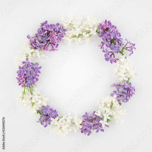 White purple small flowers on a white background. Summer postcard frame. Flat low copy space. top view