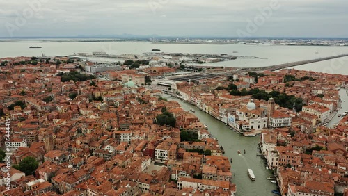 Horizontal panning from a drone, a beautiful view of the old city with traditional houses and canals. Grand Canal, Venice, Italy, bird's eye view video
