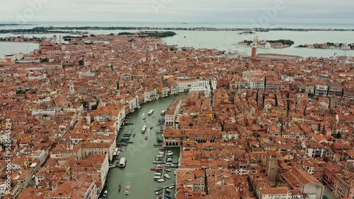 Horizontal panning from a drone, a beautiful view of the old city with traditional houses and canals. Grand Canal, Venice, Italy, bird's eye view video