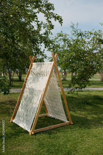 Macrame tent in the summer park