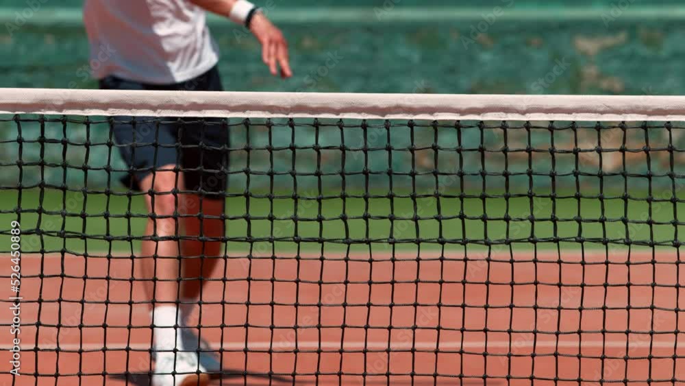 Super Slow Motion Shot of Tennis Player Hit the Net with Ball on Court at 1000fps. Super Slow Motion Shot of Tennis Player Hit the Net with Ball on Court at 1000fps.