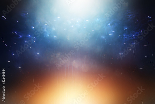background of abstract glitter lights. gold  blue and black. de focused