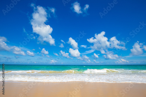 Exotic idyllic white sand sea wave beach blue sky with cloud © themorningglory