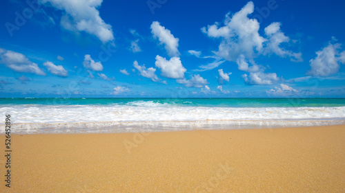 Exotic idyllic white sand sea wave beach blue sky with cloud