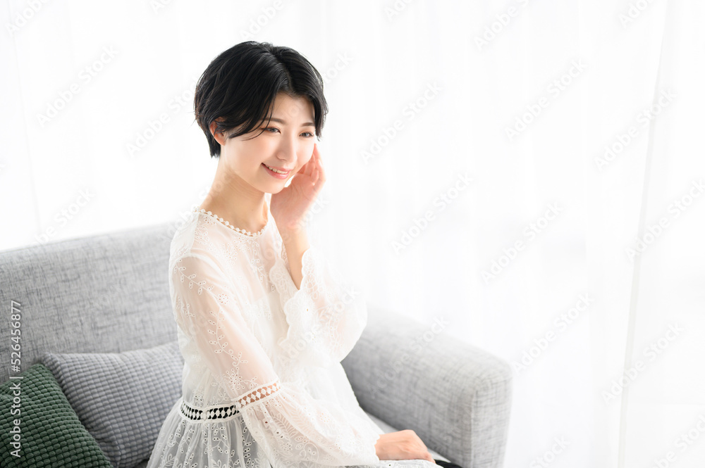 Woman on the sofa, overhead view of her skin. Woman on the sofa, overhead view of her skin.