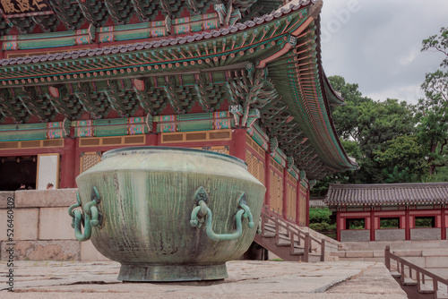 Colorful traditional Korean architecture temple building and bronze pot Changgyeonggung Palace in Seoul South Korea	