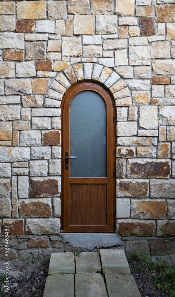 wooden doors in a stone wall