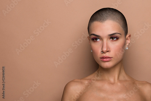 Εκτύπωση καμβά Beautiful woman with short shaved hair portrait on colored background, concept a