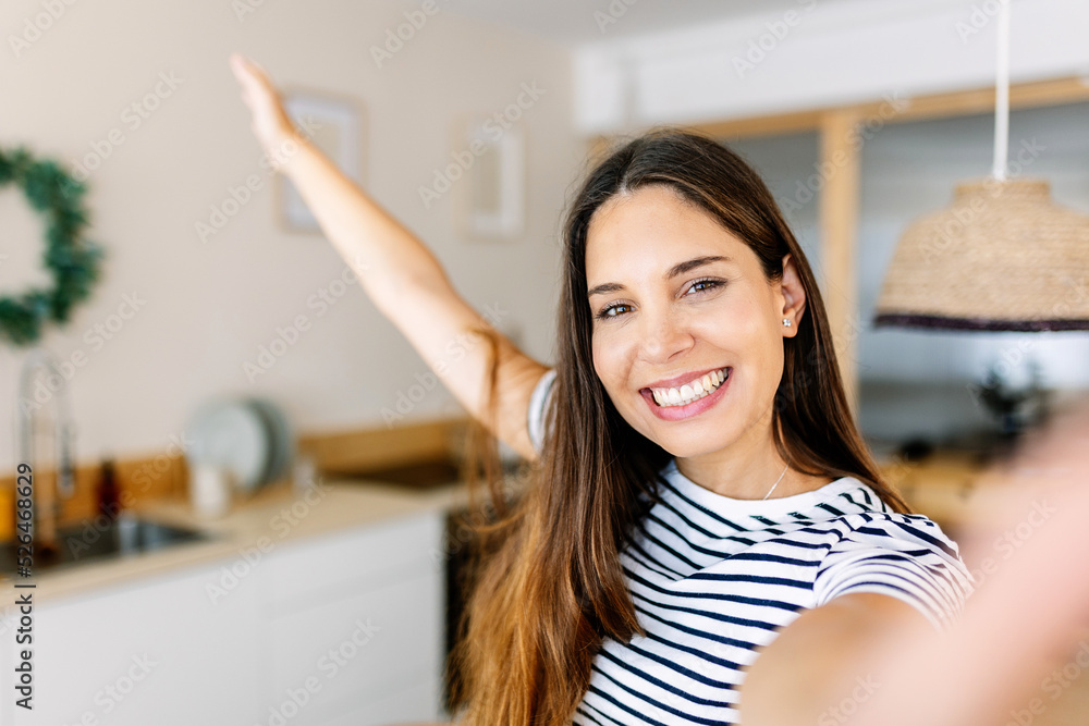 Serene happy young adult woman taking selfie portrait with phone at home - Photo of pretty female smiling at camera Serene happy young adult woman taking selfie portrait with phone at home - Photo of pretty female smiling at camera