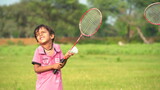 A boy plays tennis on a local ground. A little tennis player focused on the game and shot in flight after hitting the ball. Tennis kid. Sports action frame. Active games. Square size.