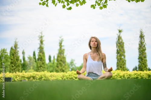 Wallpaper Mural Girl practice yoga meditation outdoor in park Torontodigital.ca