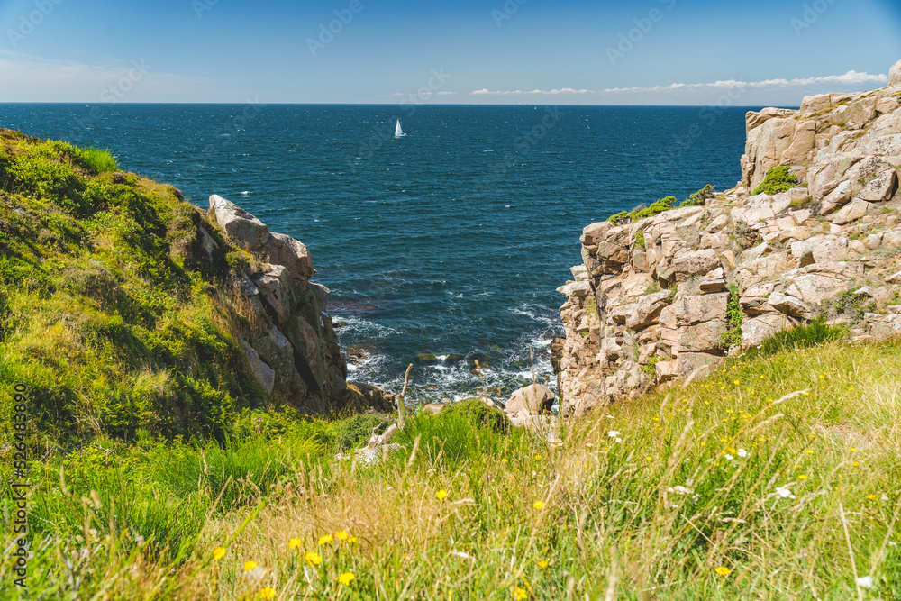 steep cliffs of nothern Bornholm coastline at baltic sea, Denmark