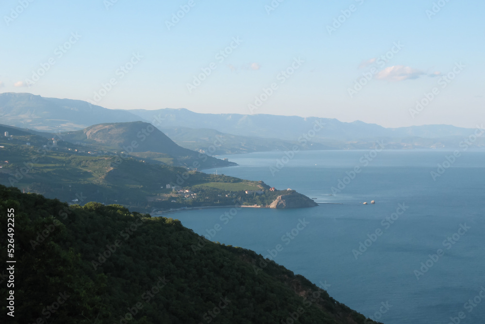 View of the calm blue sea from a high mountain
