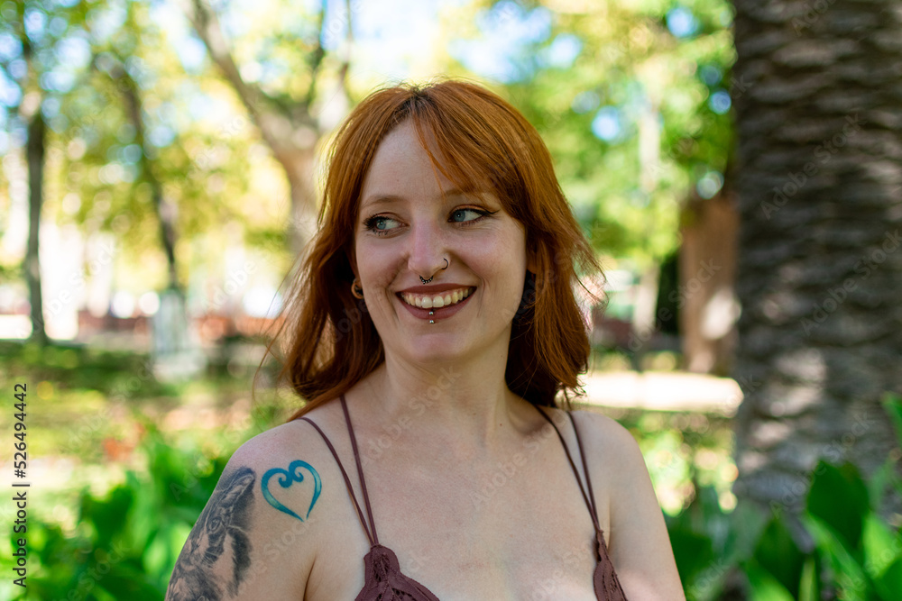 Young redhead woman smiling confident standing at park
Young redhead woman smiling confident standing at park