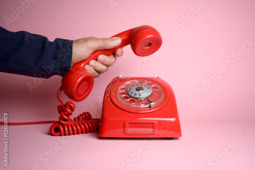 фотографія Why didn't you call? - classic rotary dial telephone being picked up by a hand