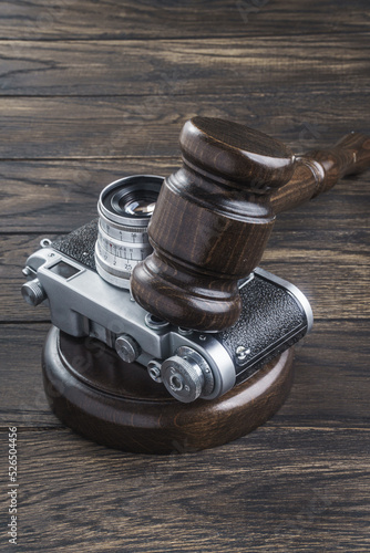 Judge's gavel and vintage camera. Privacy concept photo