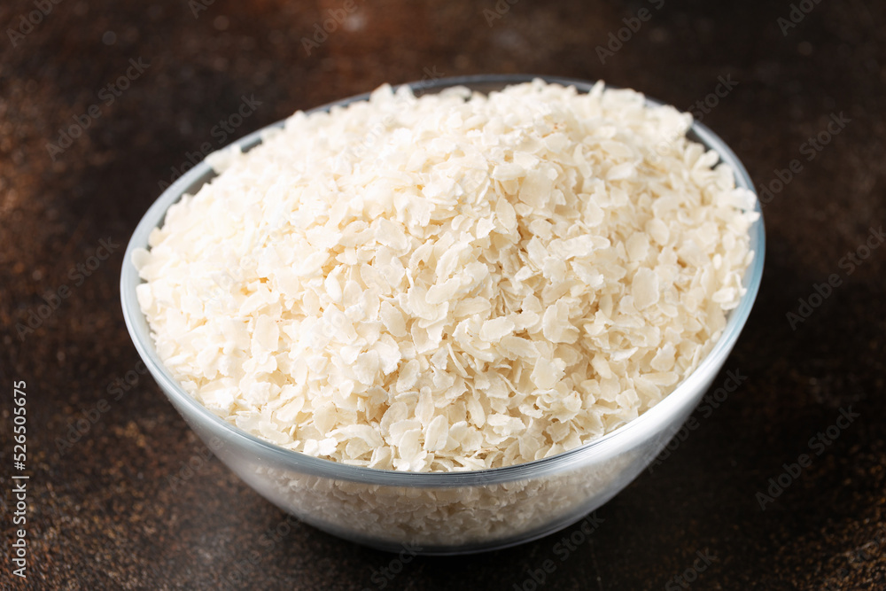 Gluten free Rice flake porridge in a glass bowl Gluten free Rice flake porridge in a glass bowl