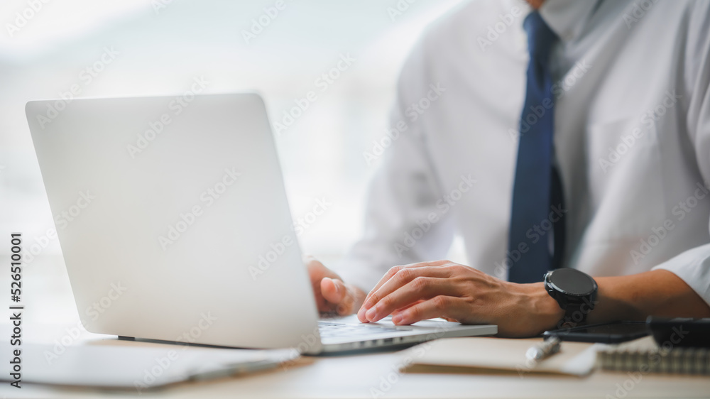 Man hands typing on computer keyboard, businessman using laptop at office, online working, internet marketing, office workplace. Man hands typing on computer keyboard, businessman using laptop at office, online working, internet marketing, office workplace.