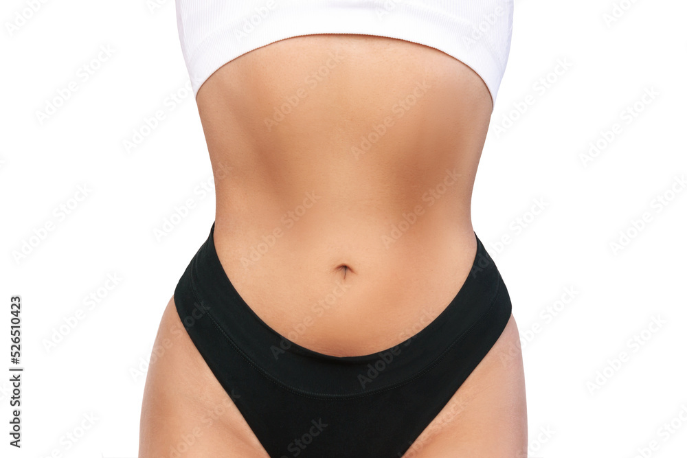 Cropped shot of young tanned fit woman with a thin waist and wide hips  isolated on a white background. Result of fitness, diet, healthy lifestyle.  Female perfect body Stock Photo