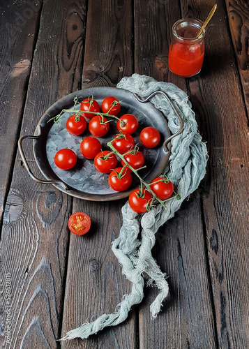 The cherry tomato is a type of small round tomato believed to be an intermediate genetic admixture between wild currant-type tomatoes and domesticated garden tomatoes