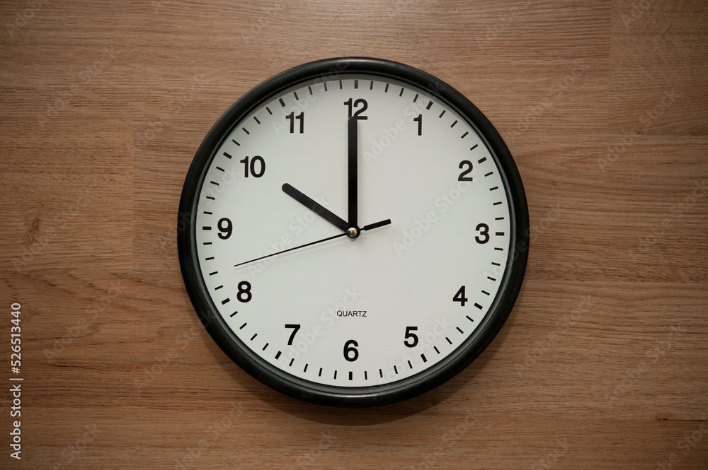 office wall clock indicating the ten o clock hour office wall clock indicating the ten o clock hour