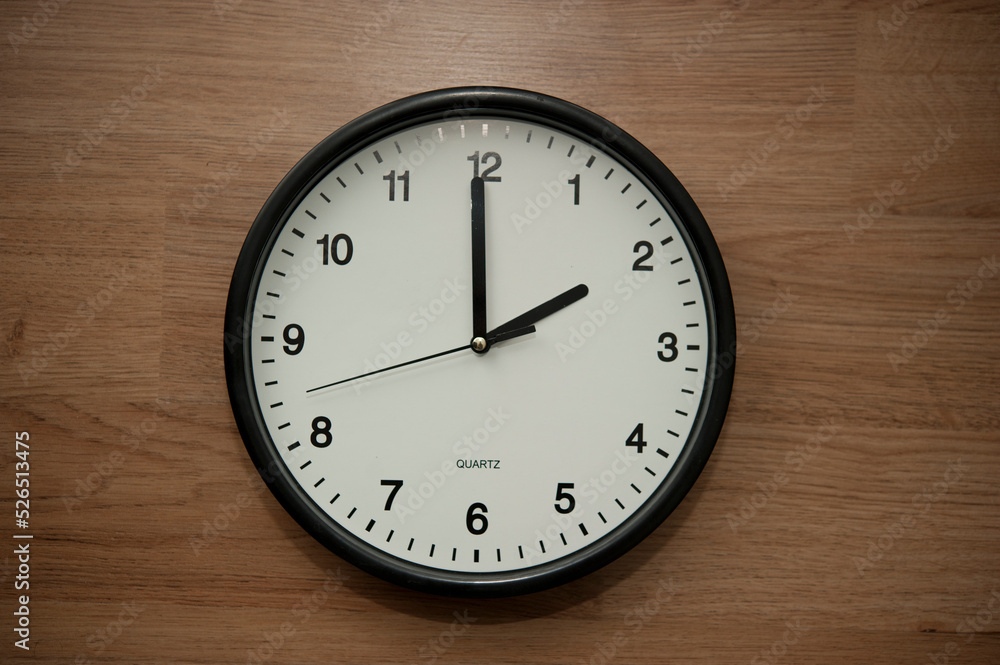 office wall clock indicating the two o clock hour office wall clock indicating the two o clock hour