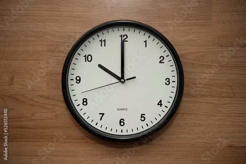 office wall clock indicating the ten o clock hour